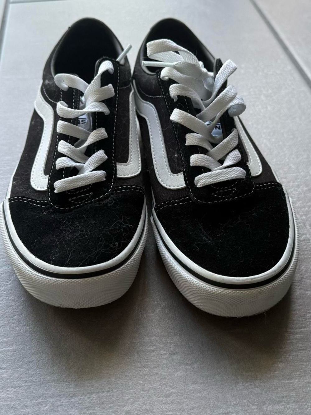 Black Vans sneakers